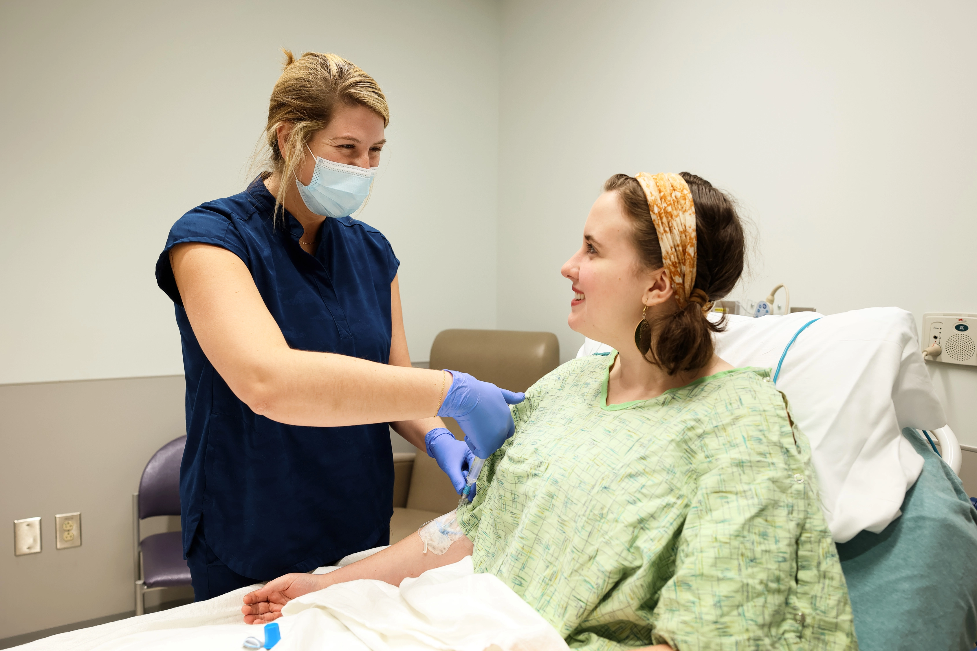  nurse drawing blood from a patient