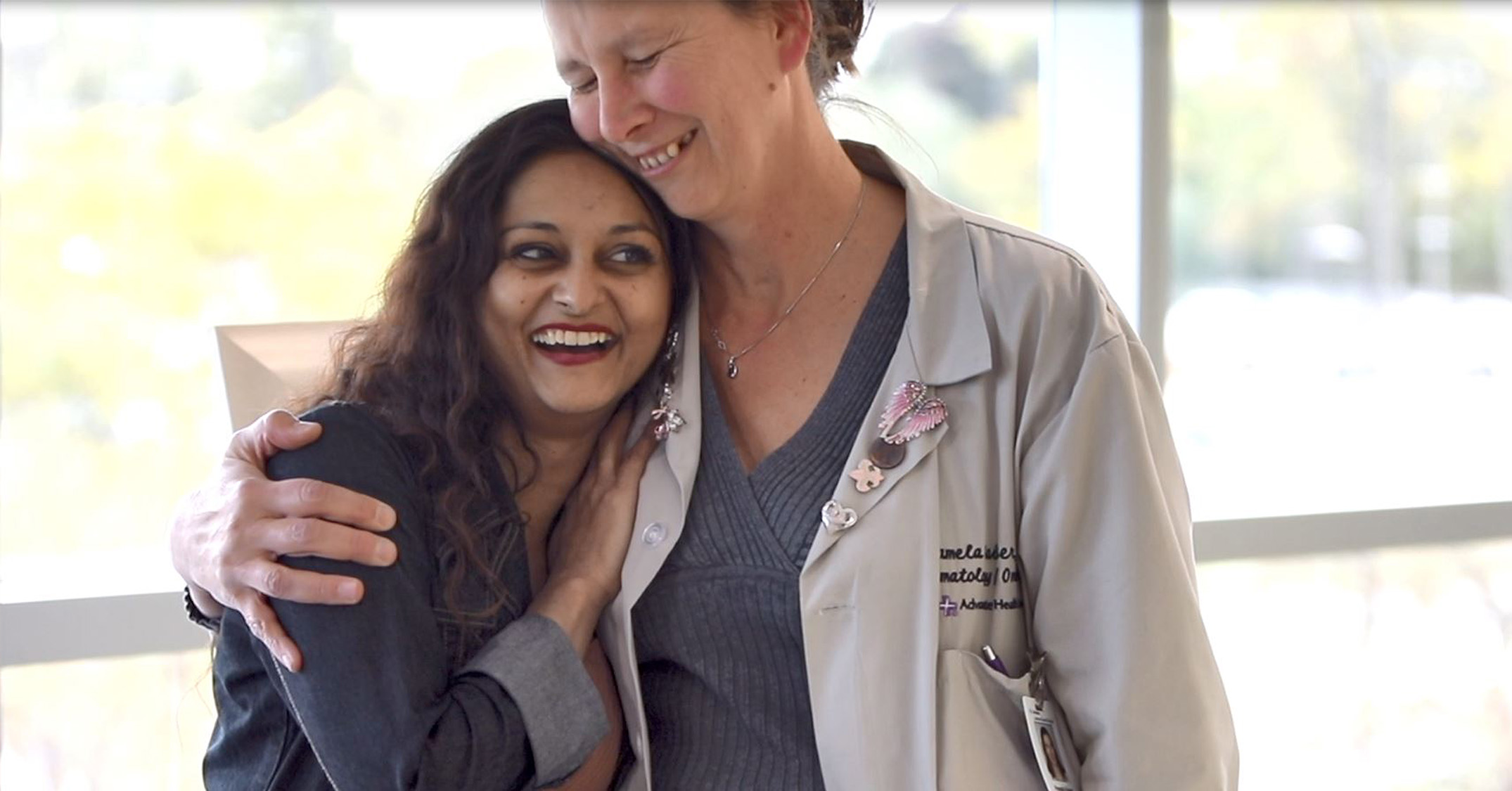 Patient hugged by physician. 