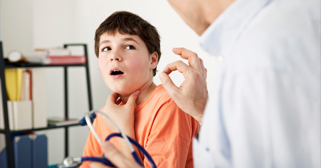 Provider conversing with a pediatric patient.