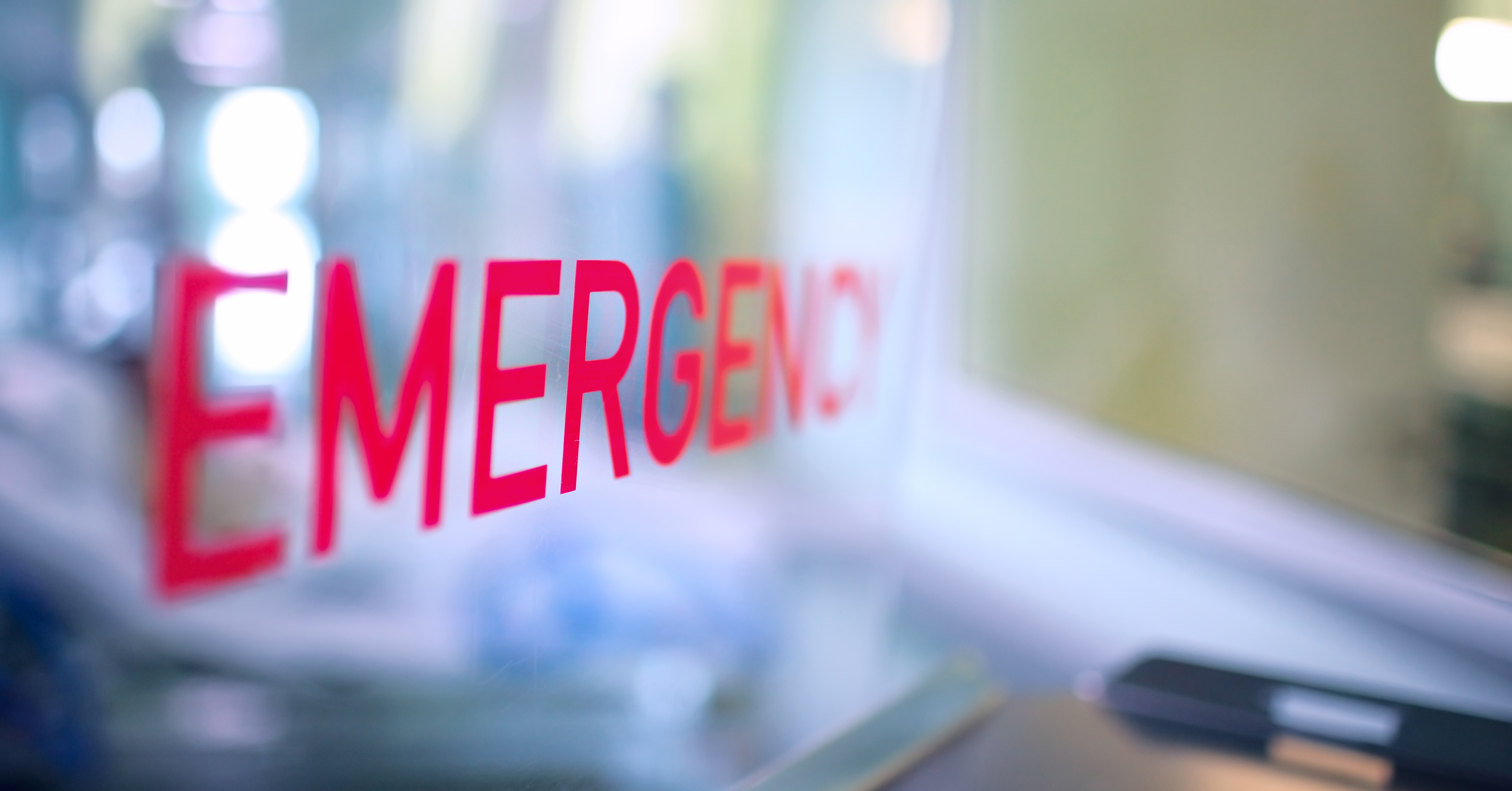 Window with the word emergency written in red. 